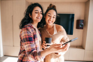 Young friends viewing photos